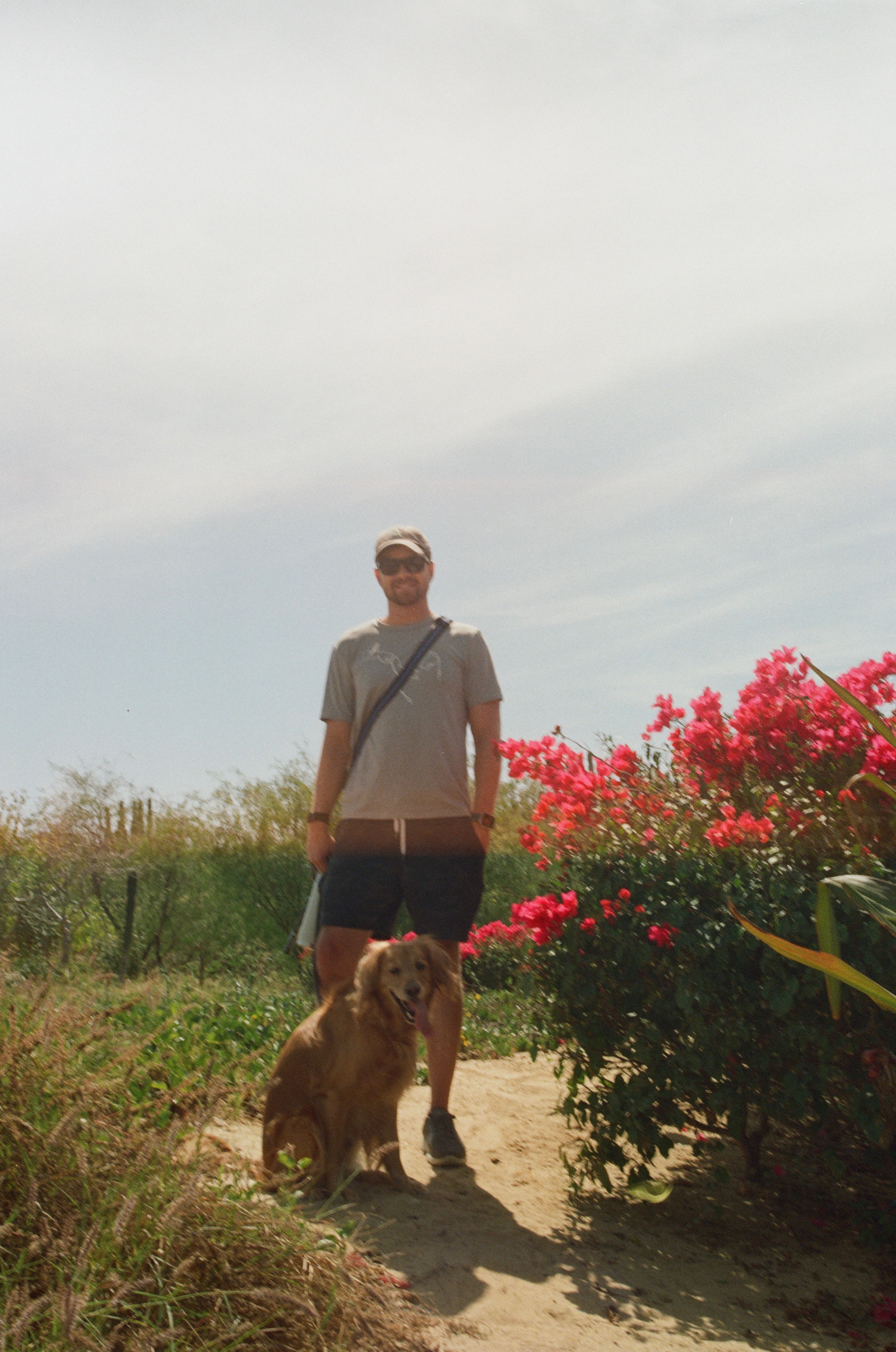 Ryan Negri standing with his dog Milo
